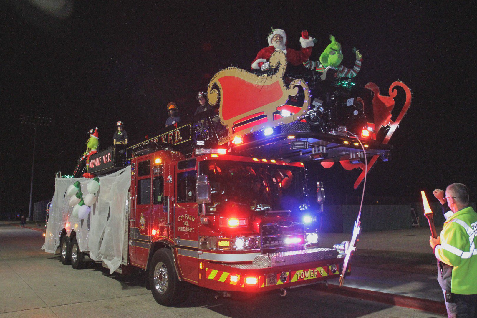 Fire truck parade with Santa and Grinch.